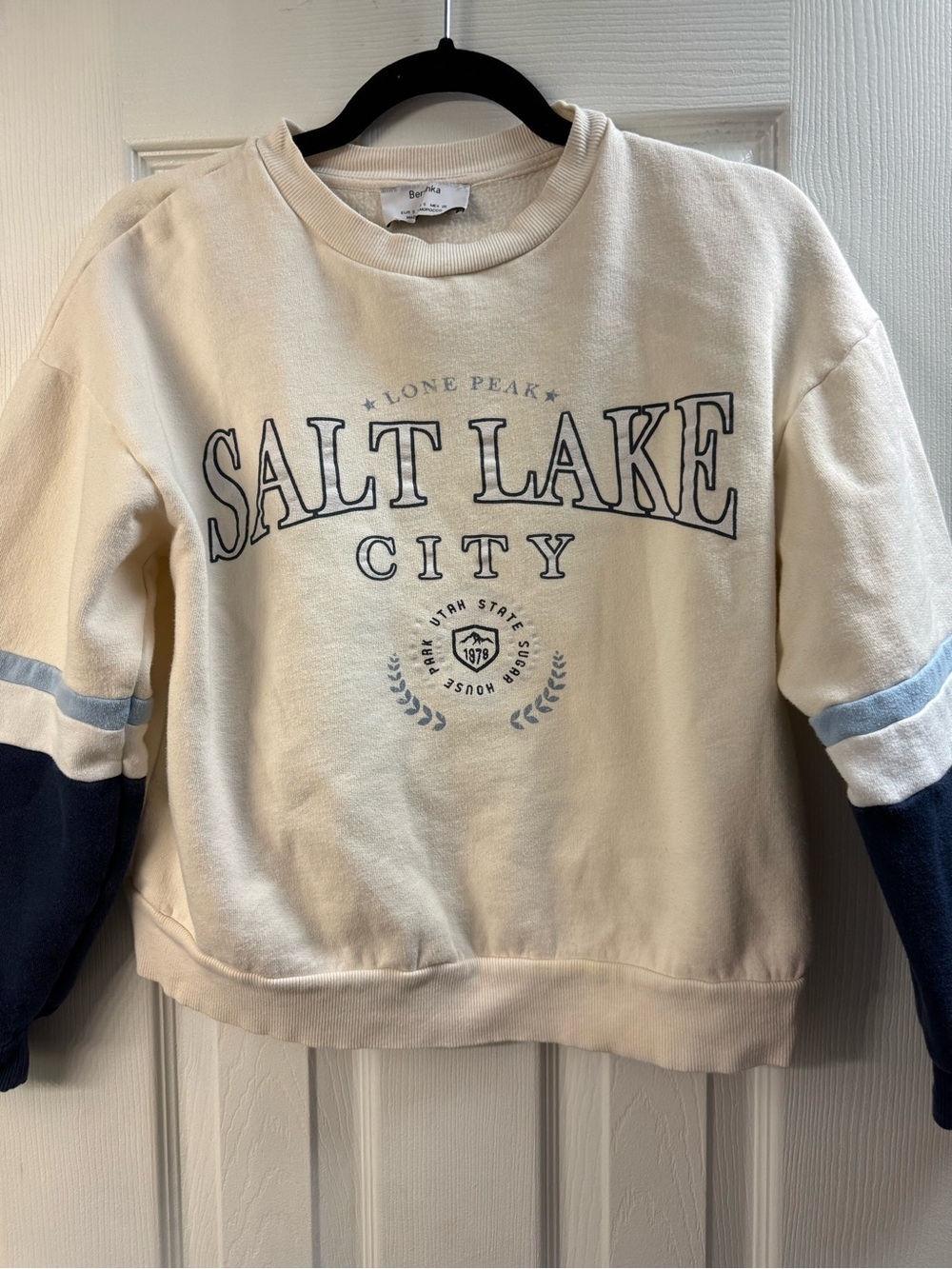 Bershka Cream Sweatshirt with Navy Sleeve Panels and Light Blue Stripes